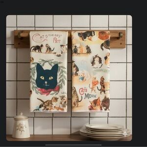 TWO TOWELS OF CATS IN FUNNY SCENARIOS. NEW WITHOUT TAGS